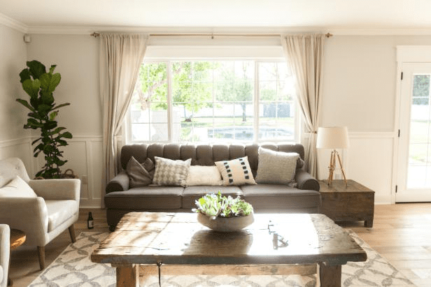 Leave windows uncovered to add to the room’s depth